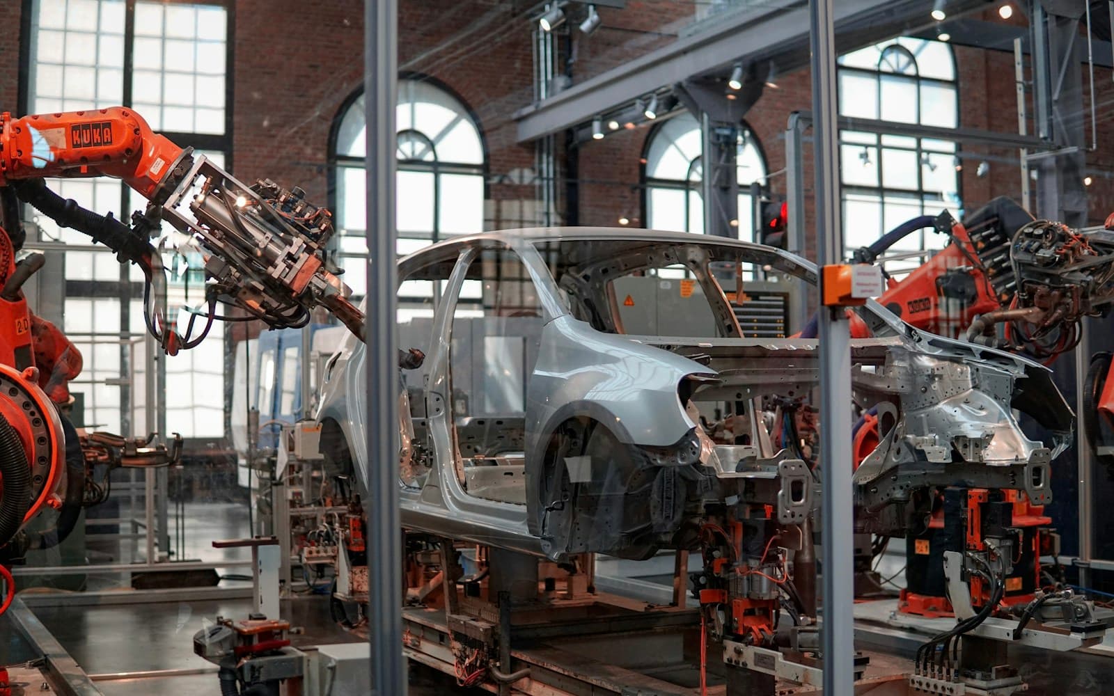 Unsplash automotive wallpaper with vehicle production robotics