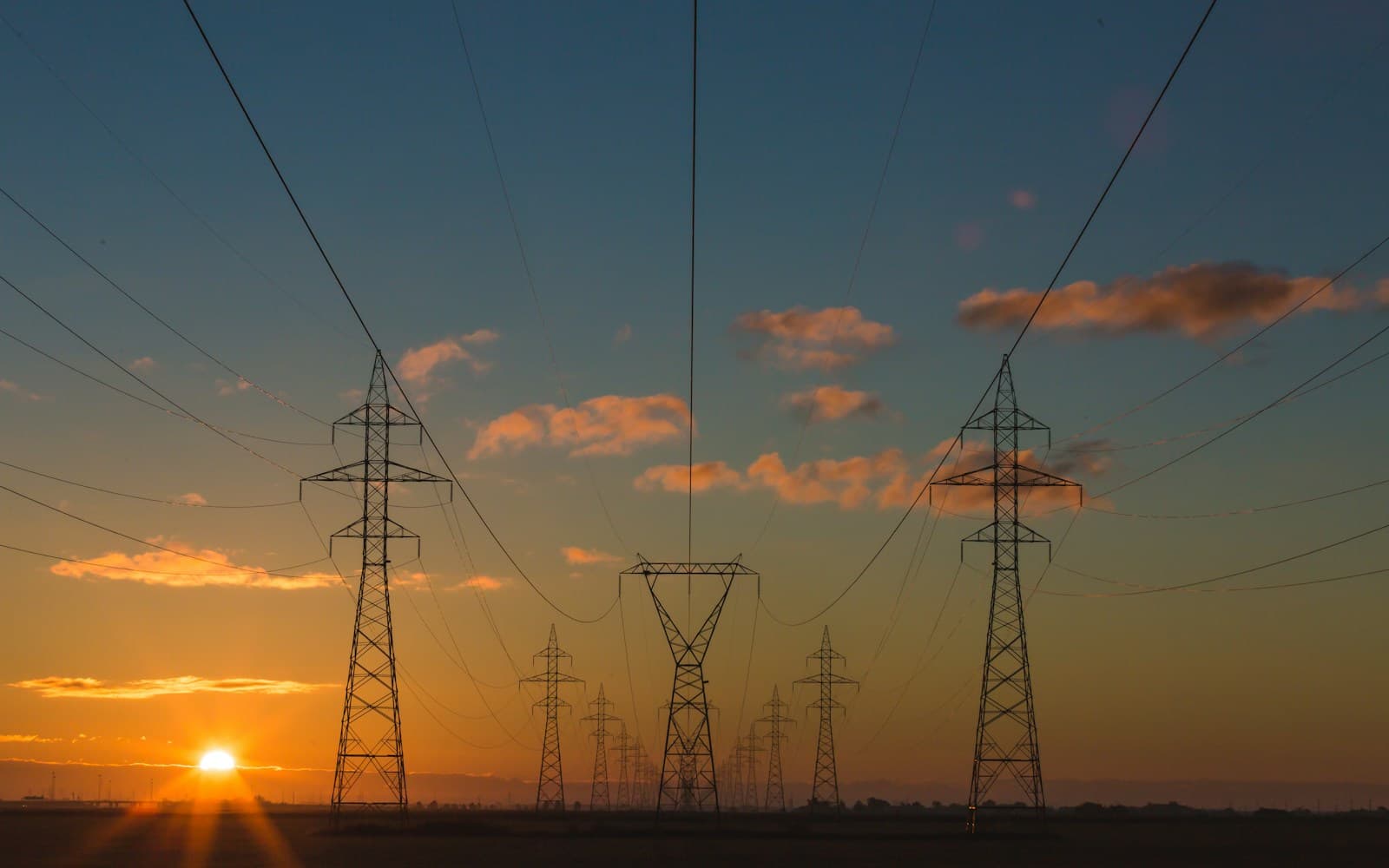 Unsplash utilities and energy wallpaper with electrical transmission towers